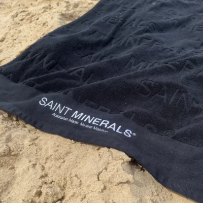 saint minerals beach towel on sand